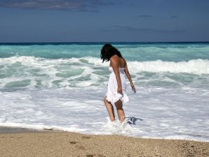 girl on beach, in the water.